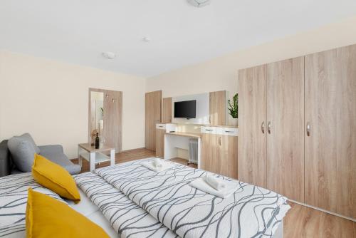 a bedroom with a large bed in a room at Nad Šťastným sklepem in Valtice