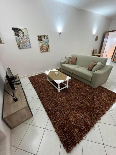 a living room with a couch and a table at Duomo Girgenti Loft in Agrigento
