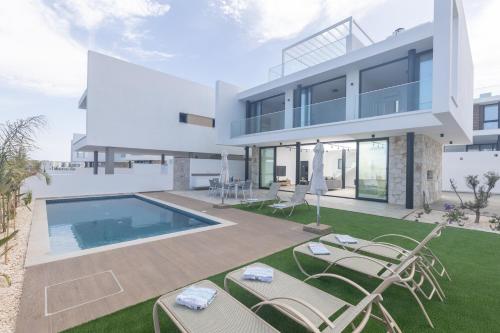 an image of a house with a swimming pool at Aqua Pearl Villas in Protaras