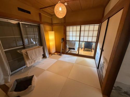 an empty room with a large window in a building at SUWAHouse in Gora