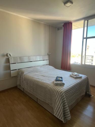 Ένα ή περισσότερα κρεβάτια σε δωμάτιο στο Departamento Peatonal II