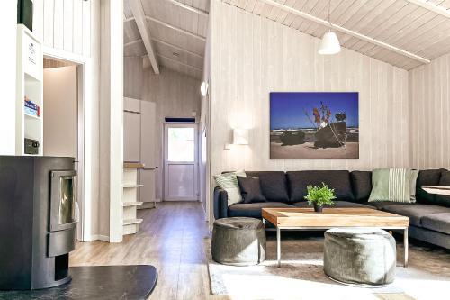 a living room with a couch and a table at Strandblick - Dorf 1 Ferienhaus 01 in Priwall