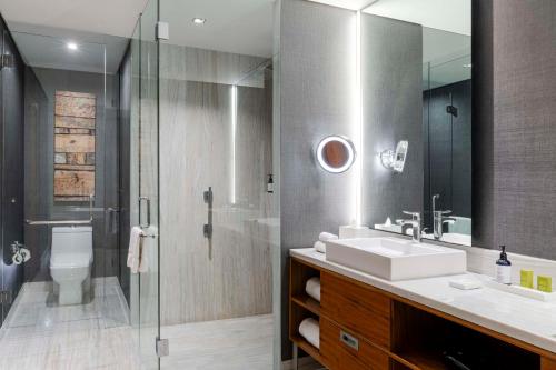 a bathroom with a sink and a shower at Hilton Mexico City Santa Fe in Mexico City
