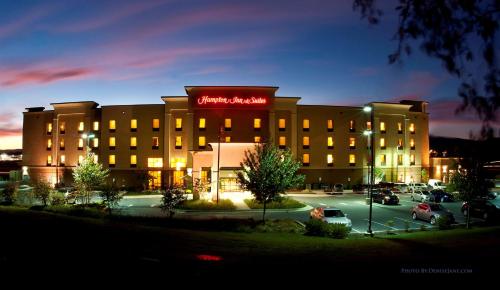 a hotel with a sign on the front of it at Hampton Inn and Suites Woodstock, Virginia in Woodstock