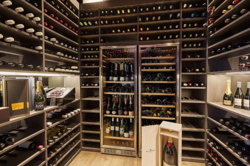 a wine cellar with lots of bottles of wine at Hilton Tallinn Park in Tallinn