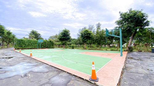 a basketball court in a parking lot with cones at Agro Hotel Bintan in Telukbakau