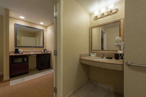 a bathroom with two sinks and a large mirror at Hampton Inn & Suites - Vicksburg in Vicksburg