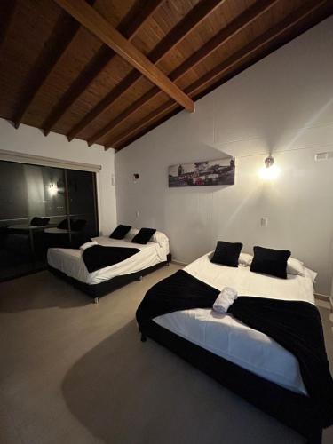 Ένα ή περισσότερα κρεβάτια σε δωμάτιο στο Forest House Pueblo Tapao