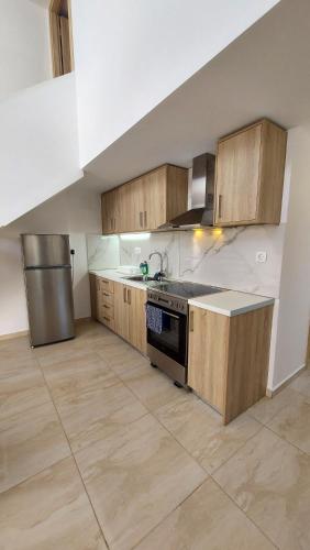 Kuchyň nebo kuchyňský kout v ubytování Argiri Apartments & Suites