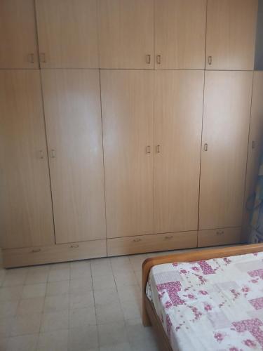 Llit o llits en una habitació de Central Apartement