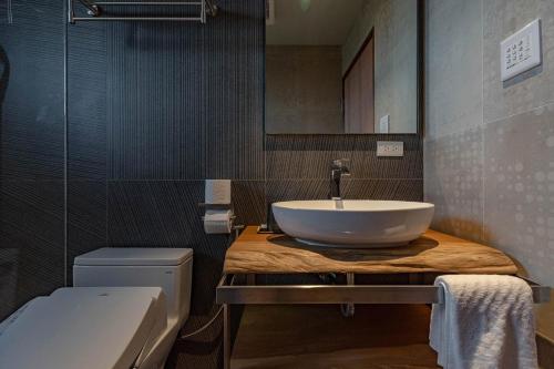 a bathroom with a sink and a toilet at 全村的希望Hope of village in Dongshan