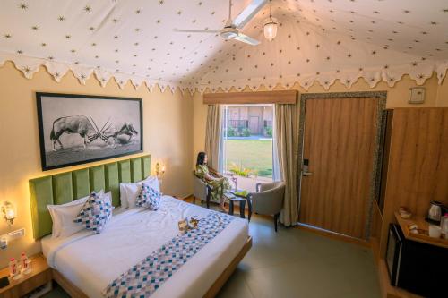 a bedroom with a bed in a room with a window at Imperia Resort by The Sky Imperial, Nathdwara in Nāthdwāra
