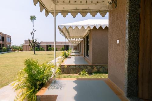 an outside view of a building with a walkway at Imperia Resort by The Sky Imperial, Nathdwara in Nāthdwāra