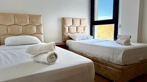 Ένα ή περισσότερα κρεβάτια σε δωμάτιο στο Appartement Confort Vue Mer I Piscine et Parking I Exclusivement aux Familles