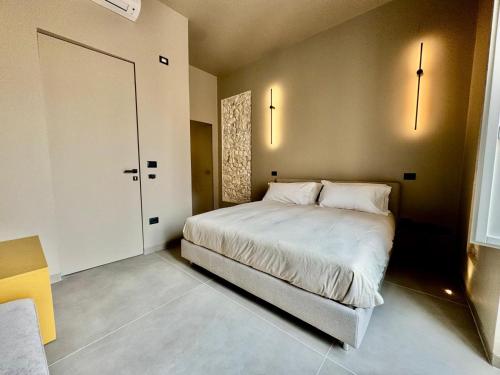 Ένα ή περισσότερα κρεβάτια σε δωμάτιο στο Vittoria 61 Apartment