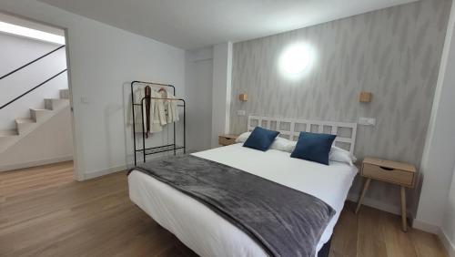 En eller flere senge i et værelse på Casa del Mar