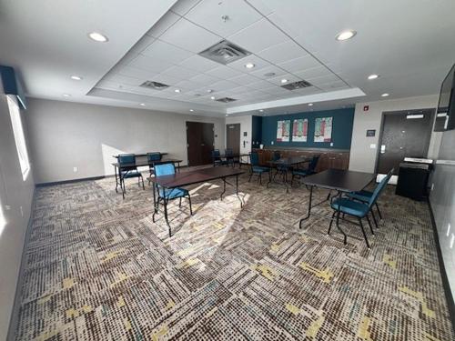 a conference room with tables and chairs on a rug at Hampton Inn & Suites Deptford, Nj in Deptford