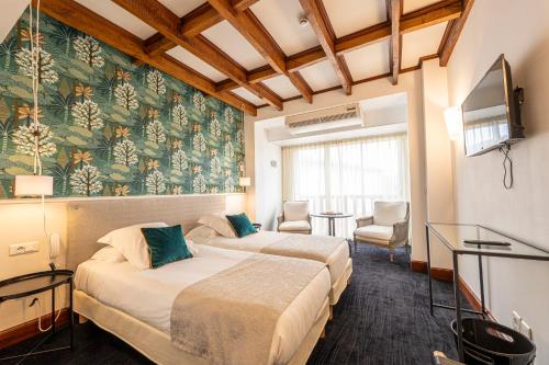 Postel nebo postele na pokoji v ubytování Hôtel Ithurria - Teritoria