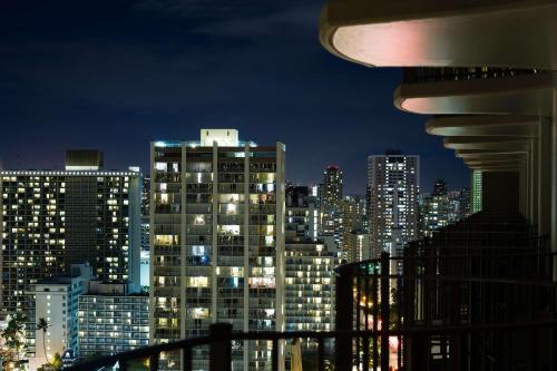 a view of a city skyline at night at Hilton Waikiki Beach Resort & Spa in Honolulu