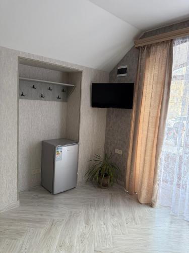 TV in/ali zabaviščno središče v nastanitvi NarVar Hotel