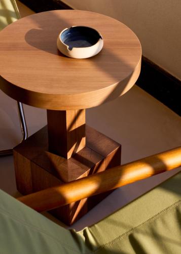 a wooden table with a bowl on top of it at Ace Hotel & Swim Club Athens in Athens