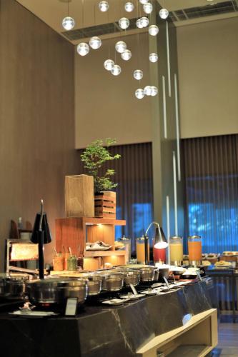 a buffet of food on a table in a room at Hilton Barra Rio de Janeiro in Rio de Janeiro