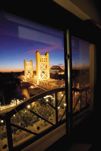 a view of a bridge from a window of a building at Embassy Suites by Hilton Sacramento Riverfront Promenade in Sacramento
