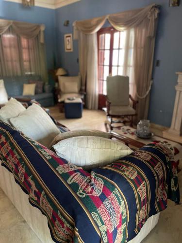 a bedroom with a bed with a blanket on it at casa Salta in Salta