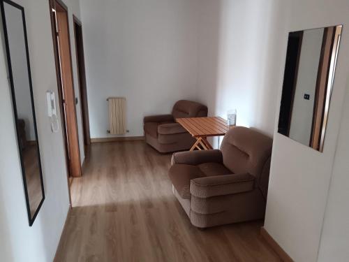 a living room with a couch and a table at Appartamento Soverato in Soverato Marina