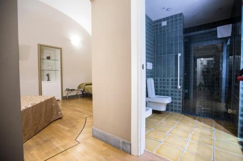 a bathroom with a shower and a toilet in a room at Hotel Villa La Colombaia in Portici
