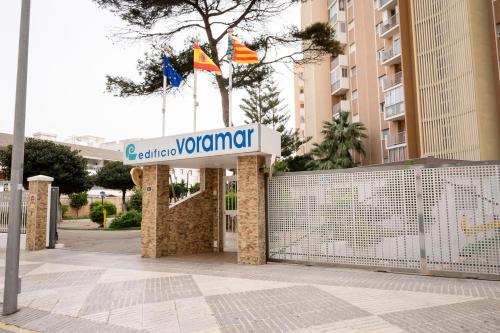 a sign for a hotel in front of a building at Voramar III by the beach large terrace in Calpe