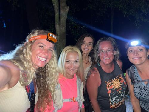 a group of women posing for a picture at a party at Mountain Top Park Hotel in Quepos