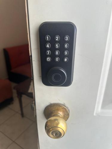 a door with a remote control on a door with a knob at La Casa de Noches de Palomitas in San Juan de los Lagos
