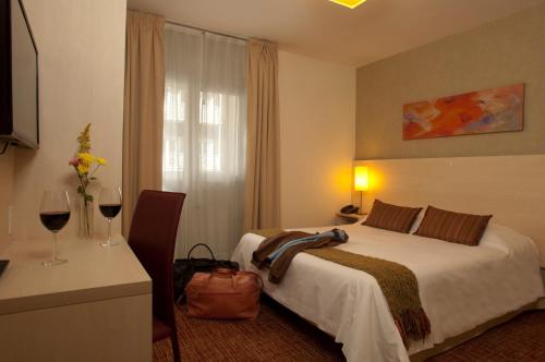 Ένα ή περισσότερα κρεβάτια σε δωμάτιο στο Hotel De Los Andes