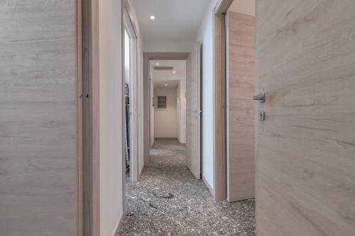 a hallway with wooden walls and a hallway with a hallway at Santa Maria Gualtieri in Pavia
