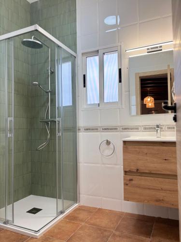 a bathroom with a shower and a sink at Casa Tramontana CR Los Cuatro Vientos in Moratalla