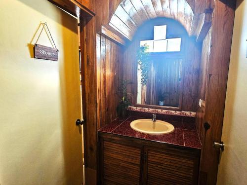 a bathroom with a sink and a mirror at Guest Room 2A Transient Baguio Wifi Parking in Baguio