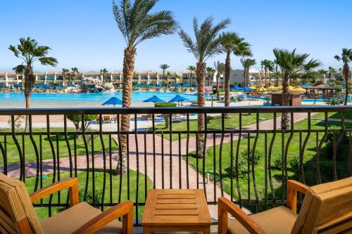 a view of the pool from the balcony of a resort at DoubleTree by Hilton Sharks Bay Resort in Sharm El Sheikh