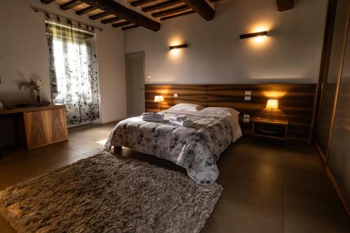 Postel nebo postele na pokoji v ubytování Tenuta Borgo San Michele