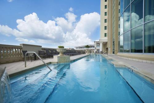 a swimming pool on the side of a building at Embassy Suites by Hilton Tampa Downtown Convention Center in Tampa