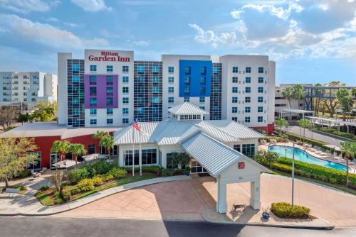 an aerial view of a hotel with a pool at Hilton Garden Inn Tampa Airport/Westshore in Tampa