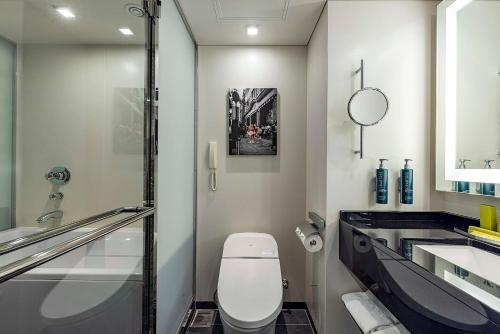 a bathroom with a toilet and a sink at Hilton Tokyo Hotel in Tokyo