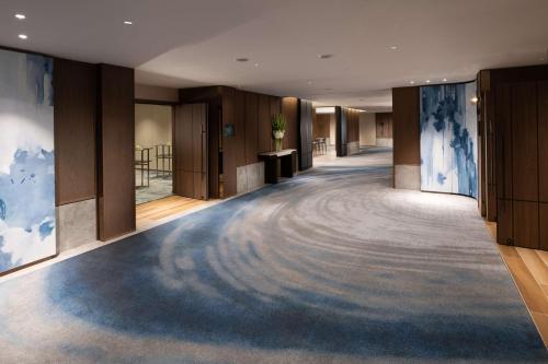 a hallway with a large carpet in a building at Hilton Tokyo Hotel in Tokyo