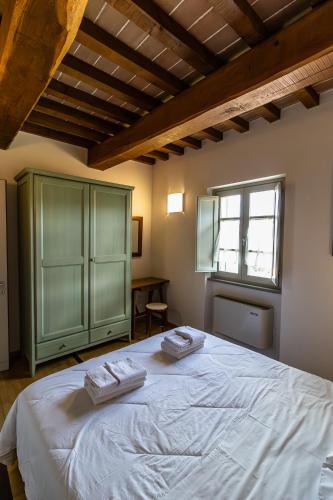 Postel nebo postele na pokoji v ubytování Tenuta Borgo San Michele