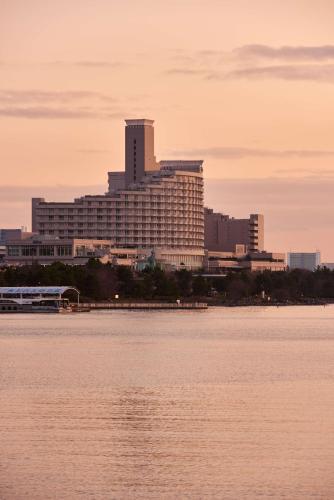 a large building next to a large body of water at Hilton Tokyo Odaiba in Tokyo