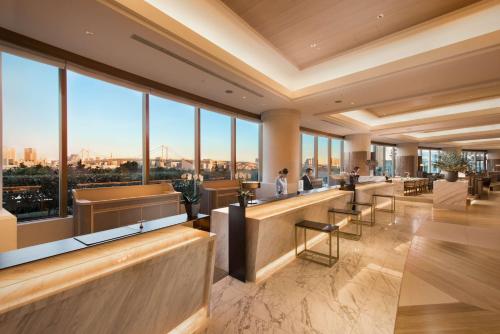 a lobby with a view of the city at Hilton Tokyo Odaiba in Tokyo