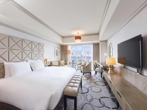 a hotel room with a large bed and a television at Hilton Tokyo Odaiba in Tokyo
