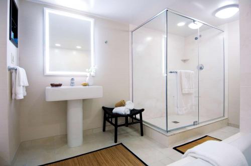 a bathroom with a sink and a shower at Hilton Orlando Buena Vista Palace - Disney Springs Area in Orlando