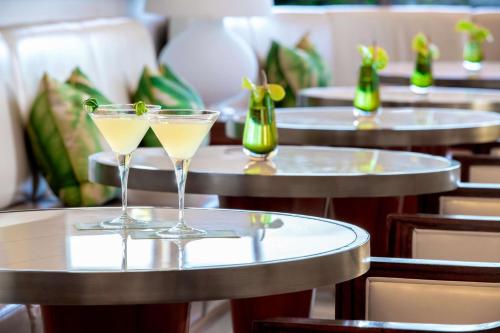 two champagne glasses sitting on top of tables at Waldorf Astoria Beverly Hills in Los Angeles
