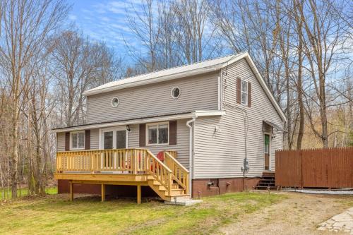 a large house with a porch and a deck at Cozy 3BR Retreat in Downtown Bethlehem - Hot Tub, Trails, Near Ski & Hike in Bethlehem